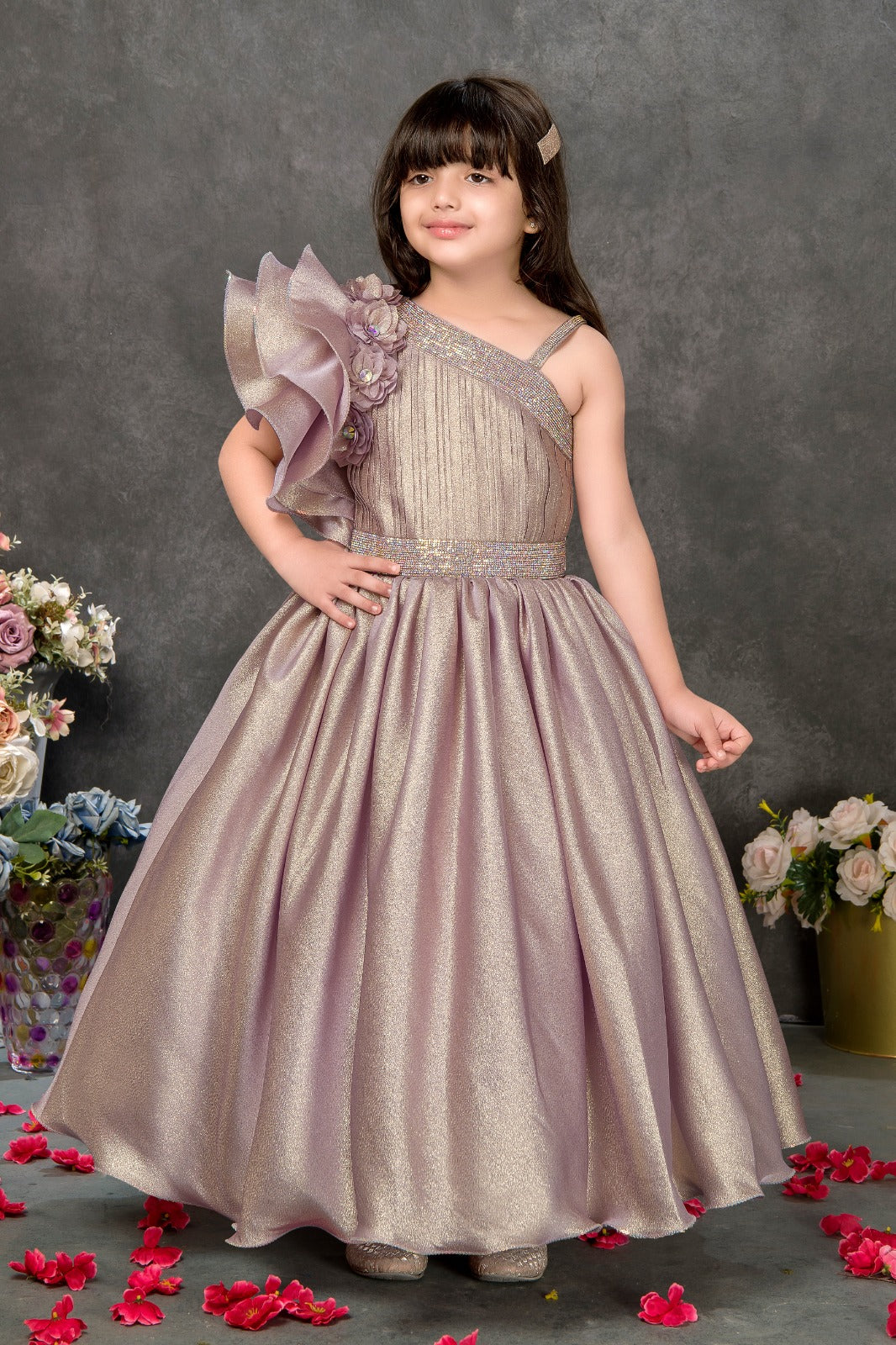 Premium Lilac One-Shoulder Shimmer Gown for Girls with Dramatic Ruffle Sleeve & 3D Floral Premium Lilac One-Shoulder Shimmer Gown for Girls with Dramatic Ruffle Sleeve & 3D Floral