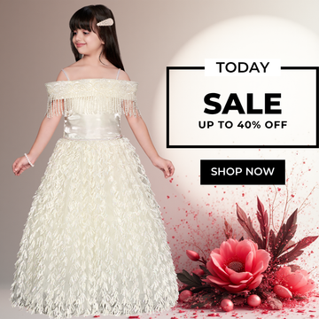Baby girl wearing an ivory off-shoulder party gown with beaded fringe neckline, satin bodice, and textured floor-length skirt for birthdays