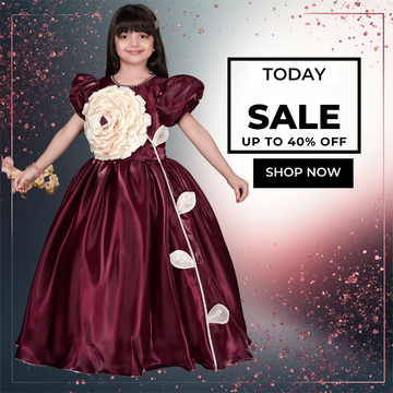 Baby girl wearing a maroon satin party gown with puff sleeves, large floral applique bodice, and elegant floor-length skirt for birthdays 
