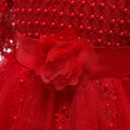 Red party dress for girls with net sleeves, floral waist, and sparkling tulle skirt – additional view