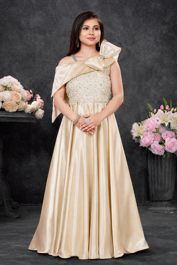 Champagne one-shoulder satin gown for girls with statement bow