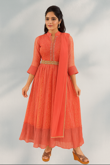 Orange Anarkali kurta set with dupatta, mirror work, and waist belt for women