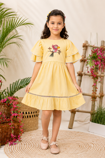 Yellow frilled dress for girls with parrot embroidery