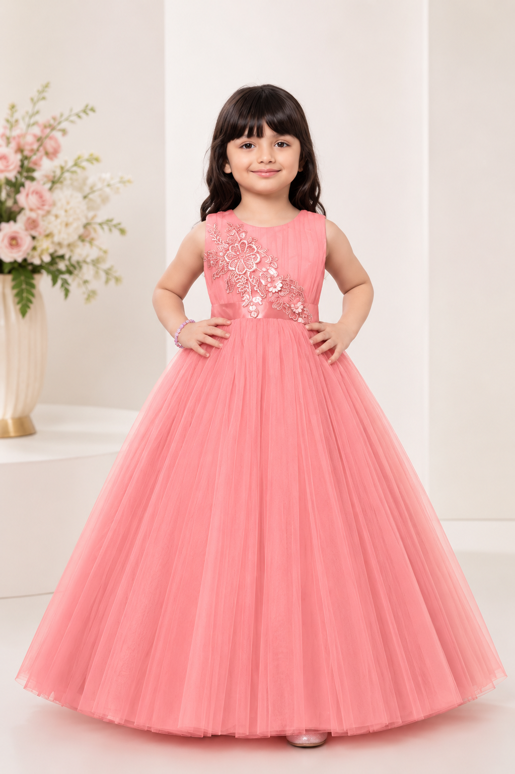 Coral pink net gown for girls with floral sequin embroidery