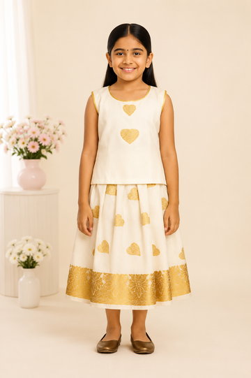Off-white Pattu frock for girls with golden heart motifs and floral zari border
