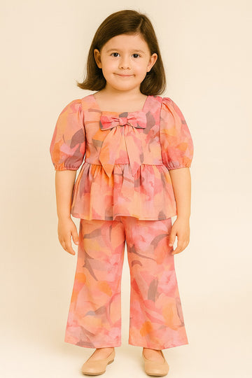 Peach Pink Abstract Print Peplum Top with Bow & Matching Wide-Leg Pants – Soft & Stylish Co-Ord Set for Girls - Inayah Fashion