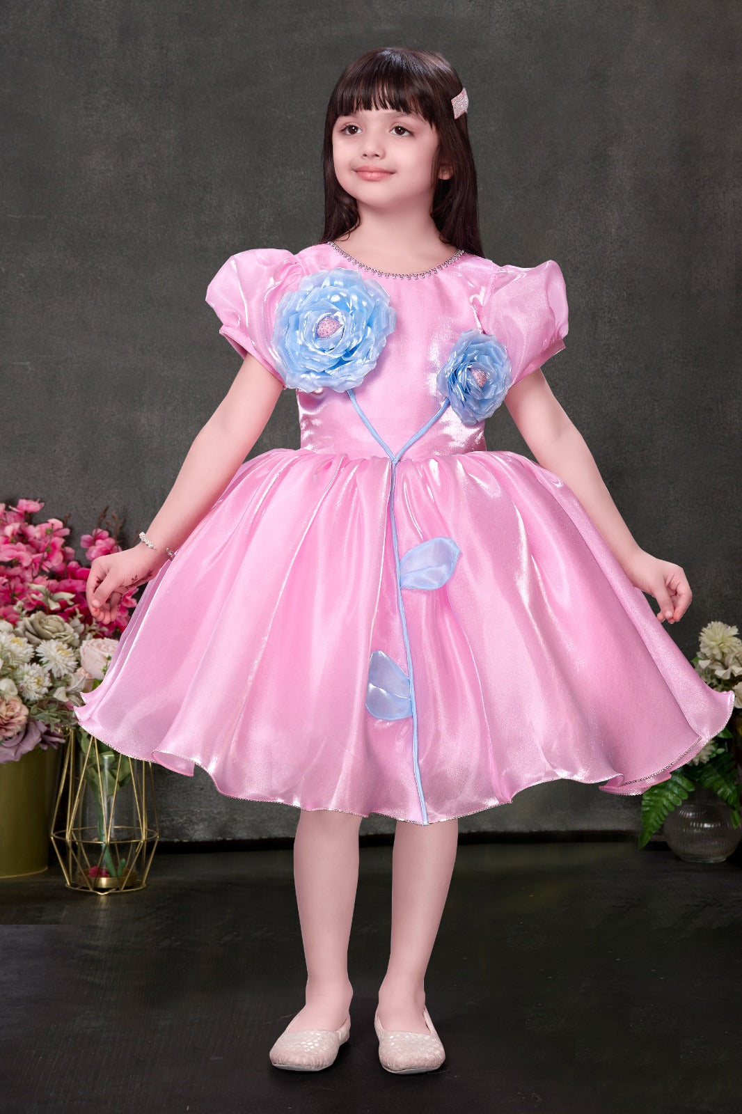 Pink shimmer party dress for girls with blue floral appliqué