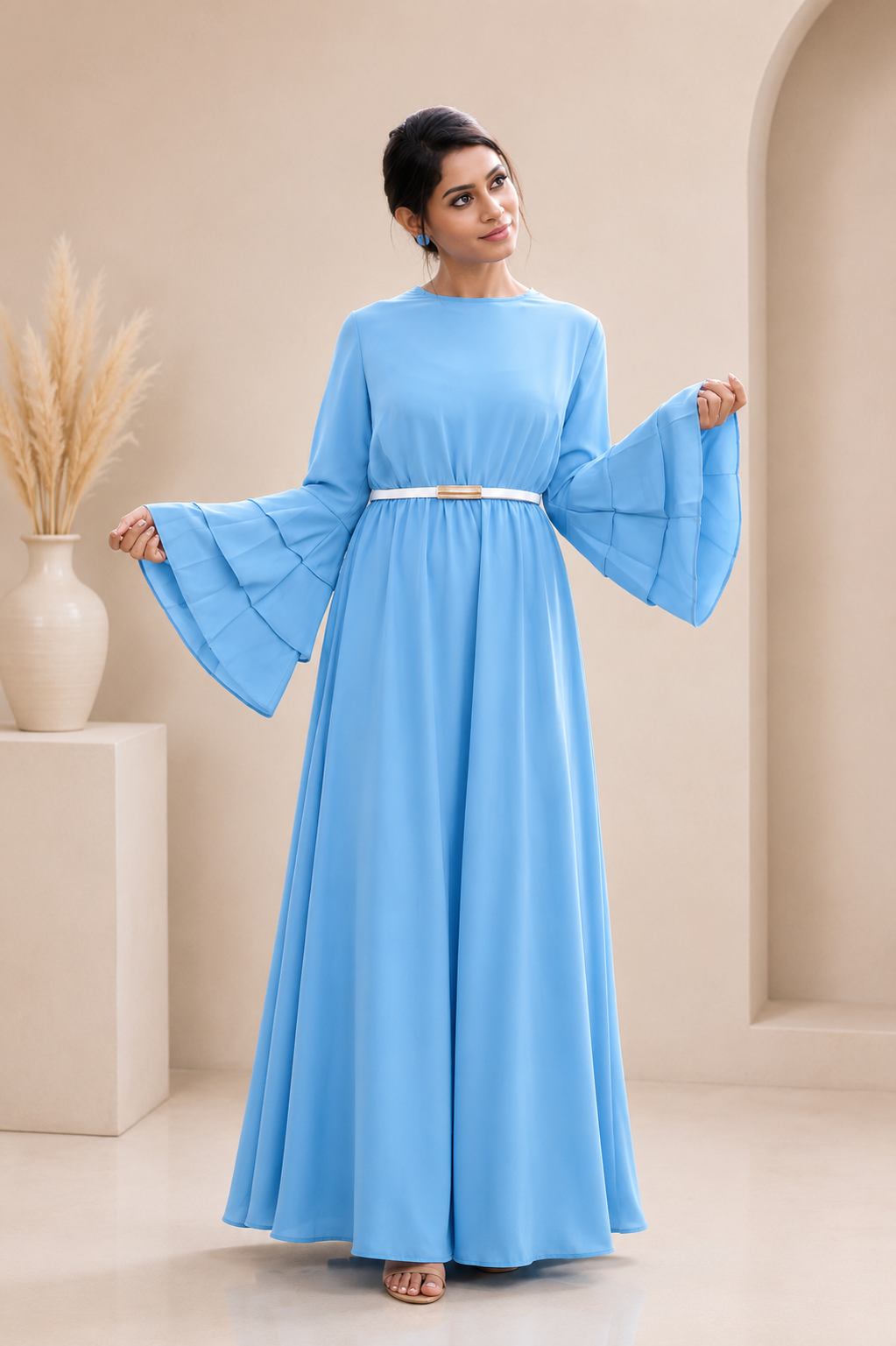 Royal blue flared gown for women with layered bell sleeves and gold buckle belt