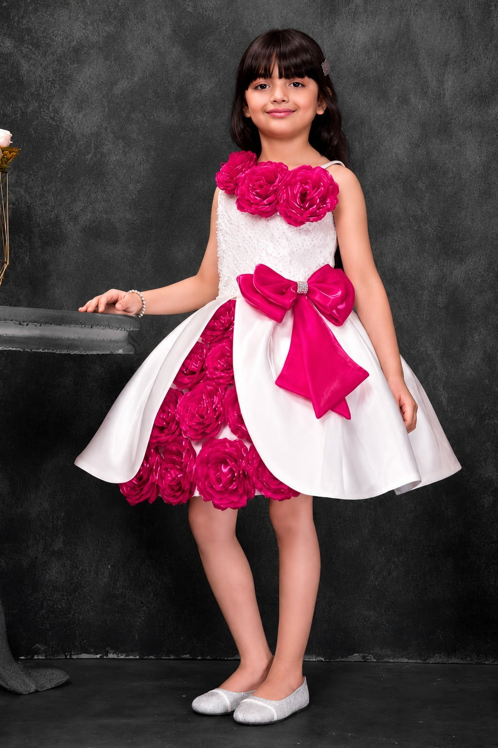 Girls white and fuchsia floral party dress with statement bow
