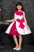 Girls white and fuchsia floral party dress with statement bow