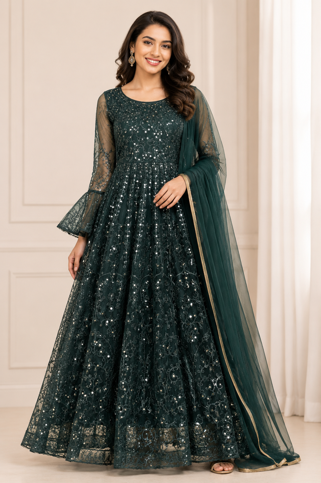 Emerald green sequinned embroidered Anarkali gown with floral thread work and matching gold-border dupatta