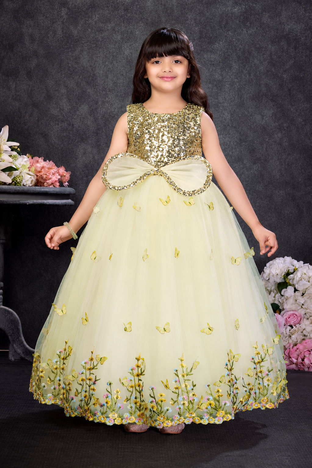 Girls yellow butterfly party gown with sequin bodice, statement bow and floral embroidery