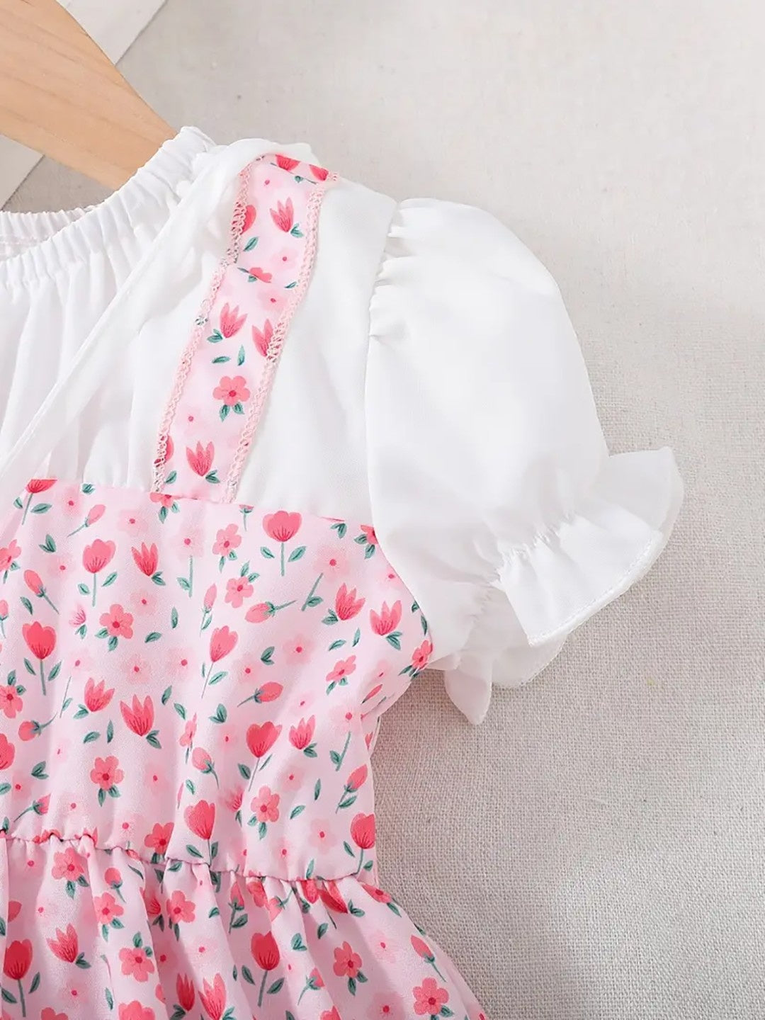 Pink tulip print frock for girls with white puff sleeves and heart sling bag – additional view